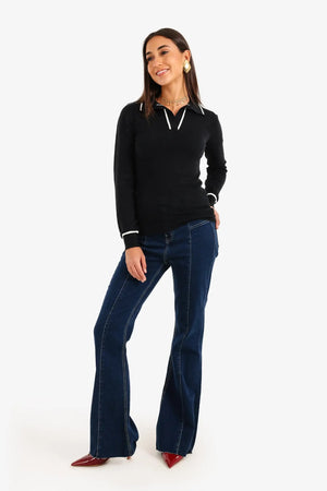 Knitted sweater with a contrasting panel