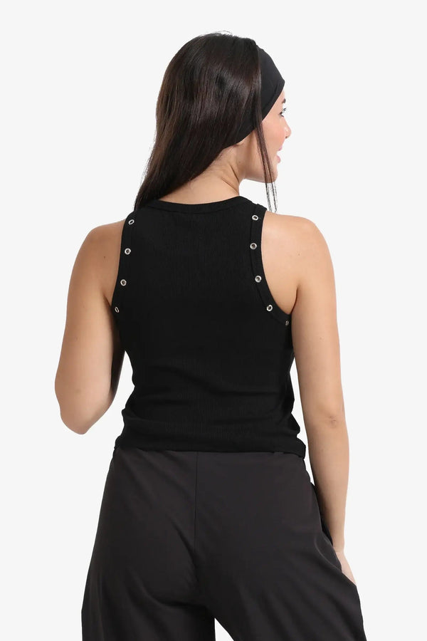 The top is decorated with metal buttons.