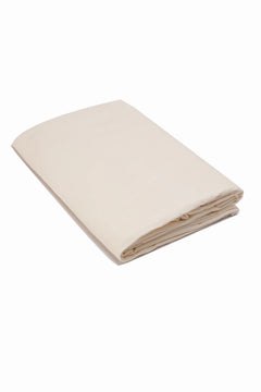 Folded beige cotton sheet on white background, soft and lightweight bedding fabric