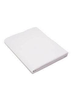 Folded white cotton fabric sheet on white background, soft textile material