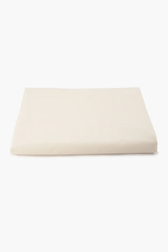 Folded beige cotton fabric on white background, soft textile for women's wear