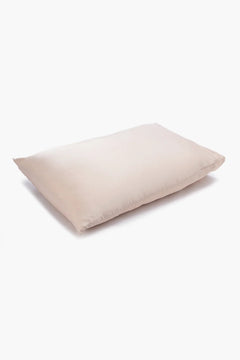 Soft beige pillow with smooth cotton cover on white background