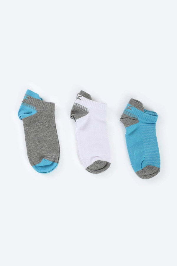 Three pairs of ankle socks in grey, white, and blue on a plain background.
