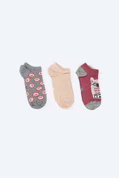 Set of three women’s cotton ankle socks in assorted colors and playful patterns on white background