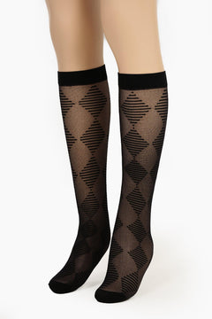 Sheer black knee-high socks with diamond pattern on model legs, stylish and feminine hosiery