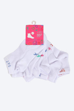 Seven pairs of white quarter length socks with colorful embroidered letters, packaged together.