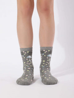 Gray high-ankle socks with colorful raindrop print and umbrella design, worn by model