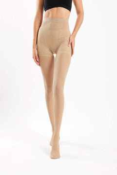 Woman wearing nude high-waisted stretch pantyhose on white background